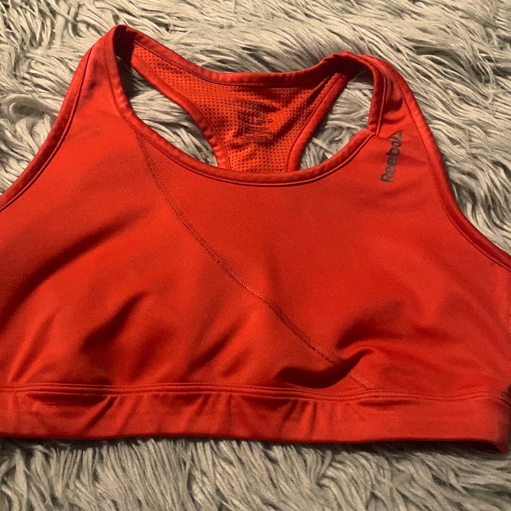 Reebok like new orange sports Bra size M